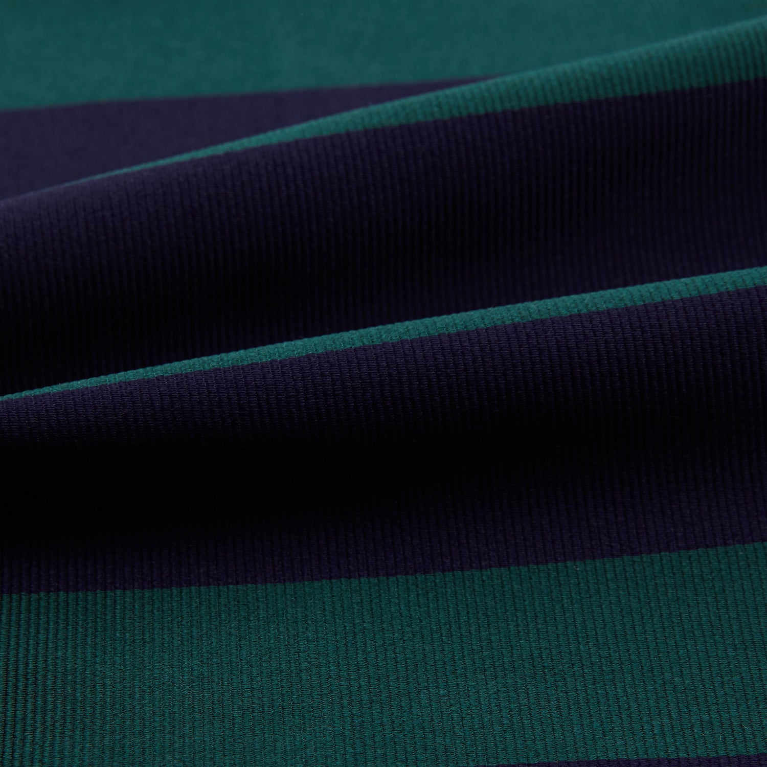 View 4 of product The Wide Green Stripe and Navy Silk Cravat from Turnbull & Asser features bold diagonal stripes in dark green and navy—an ideal wedding accessory for a refined touch of British style.