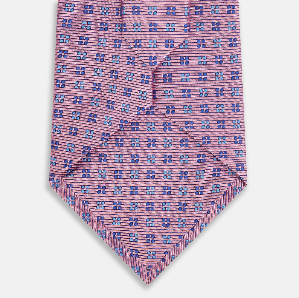 The Turnbull & Asser Blue and Pink Multi Dot Silk Tie adds a stylish, modern touch to office attire.