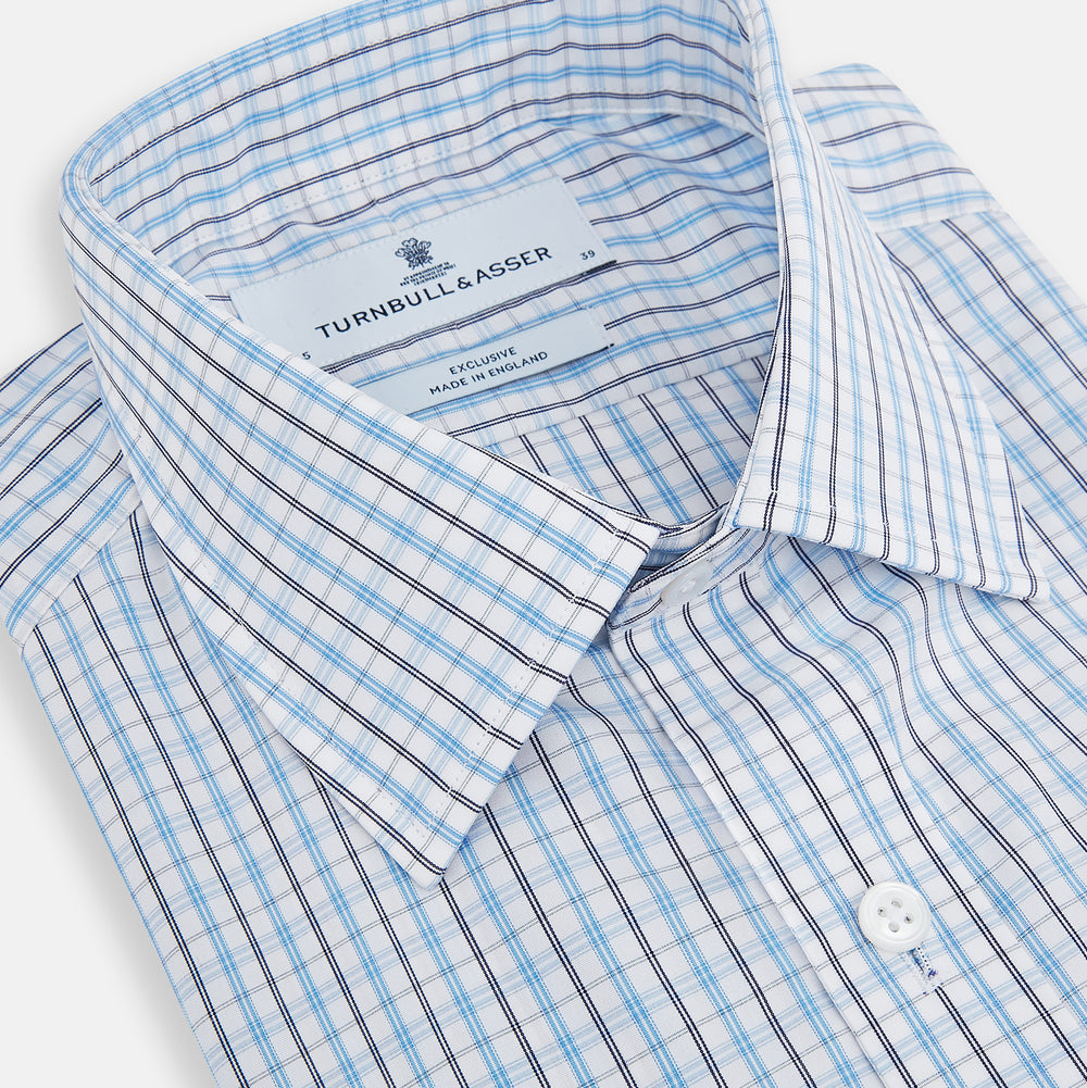 The Turnbull & Asser Navy and Blue Multi Check Mayfair Shirt features a crisp blue and navy check pattern, T&A collar, long sleeves, and a tailored Mayfair fit.