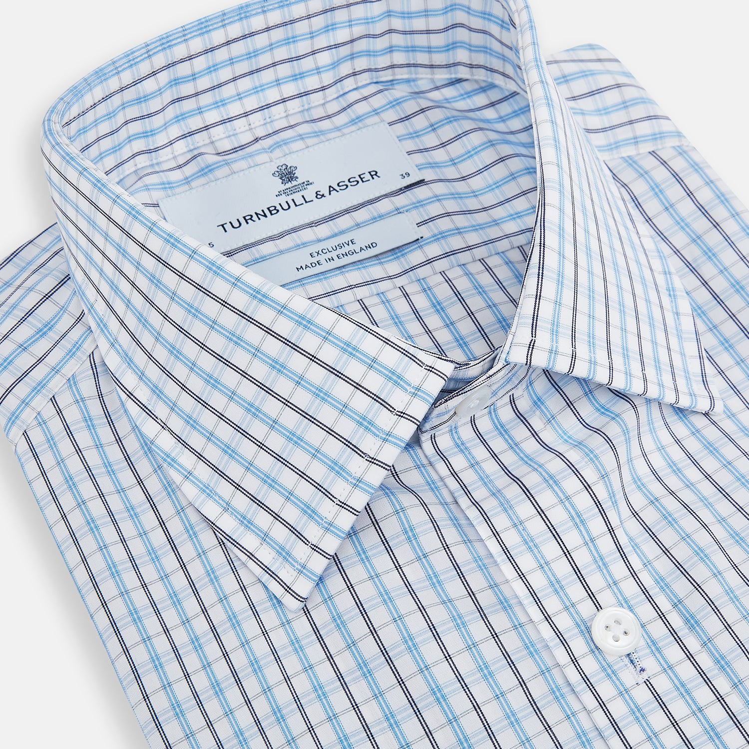View 2 of product The Turnbull & Asser Navy and Blue Multi Check Mayfair Shirt features a crisp blue and navy check pattern, T&A collar, long sleeves, and a tailored Mayfair fit.