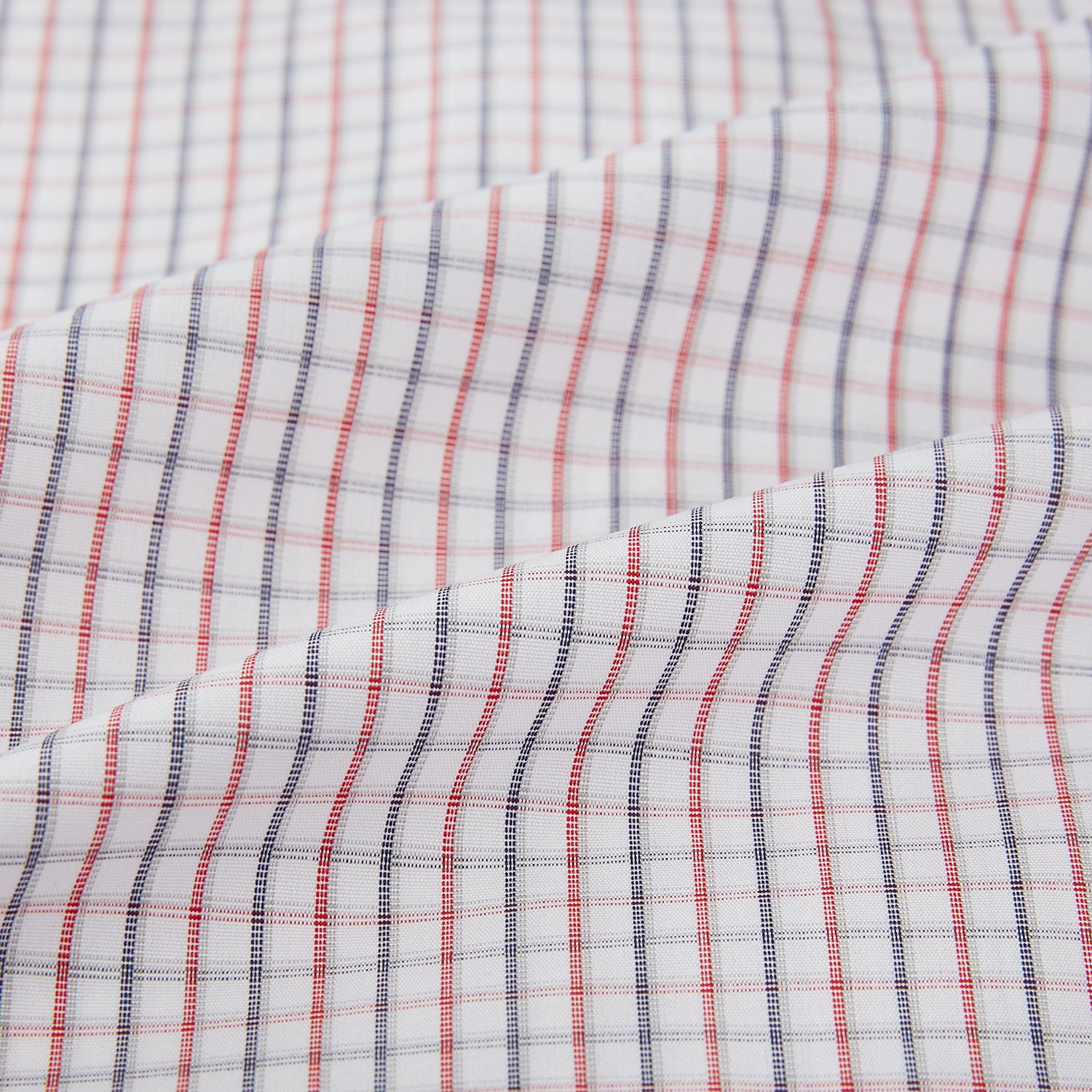 View 6 of product Turnbull & Asser Red and Blue Multi Check Mayfair Shirt with a classic T&A collar in premium Italian cotton, neatly laid flat on a white surface.