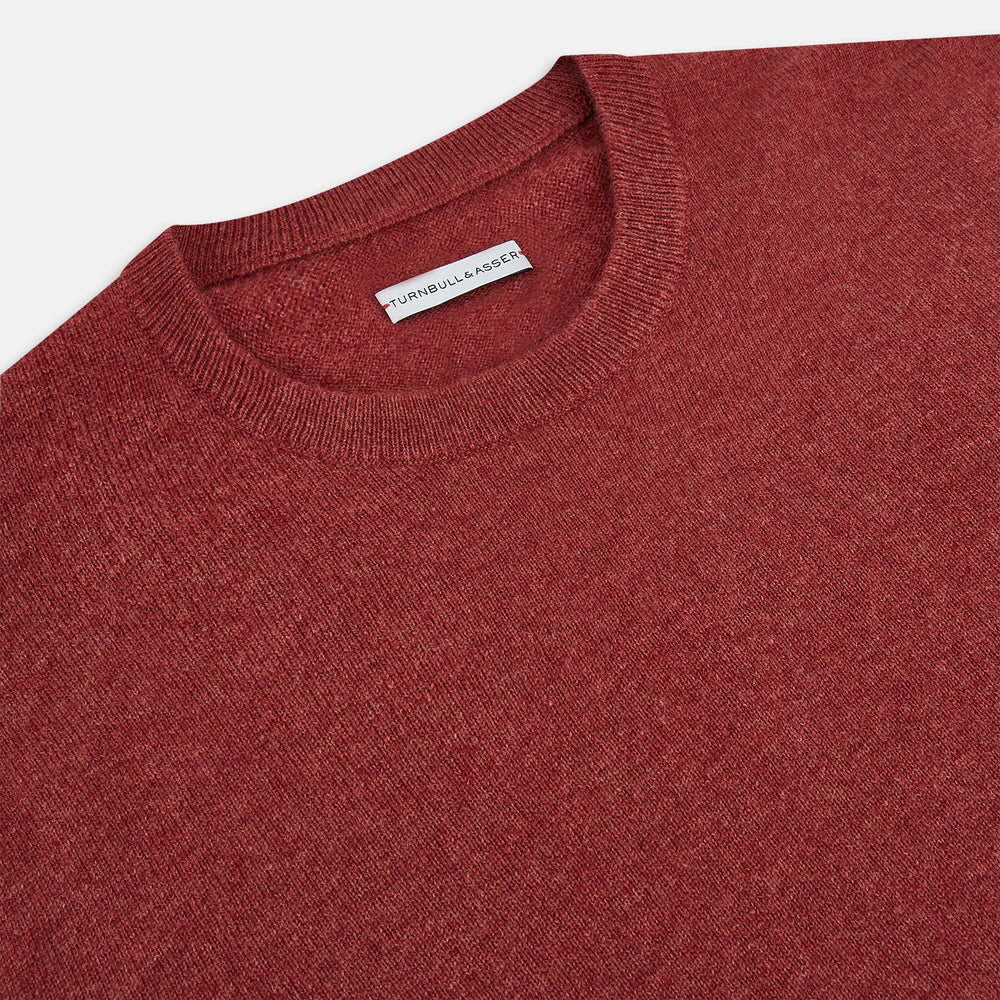 The Turnbull & Asser Crimson Red Cashmere Round Neck Jumper is a classic men’s knitwear piece, featuring long sleeves and a solid crimson hue, shown against a white background.
