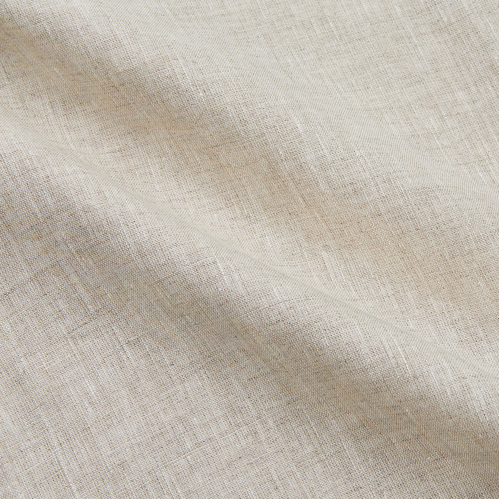 The Turnbull & Asser Light Oatmeal Linen Weekend Fit Unwin Shirt features long sleeves, a band collar, and two chest pockets—an ideal choice for effortless summer style.