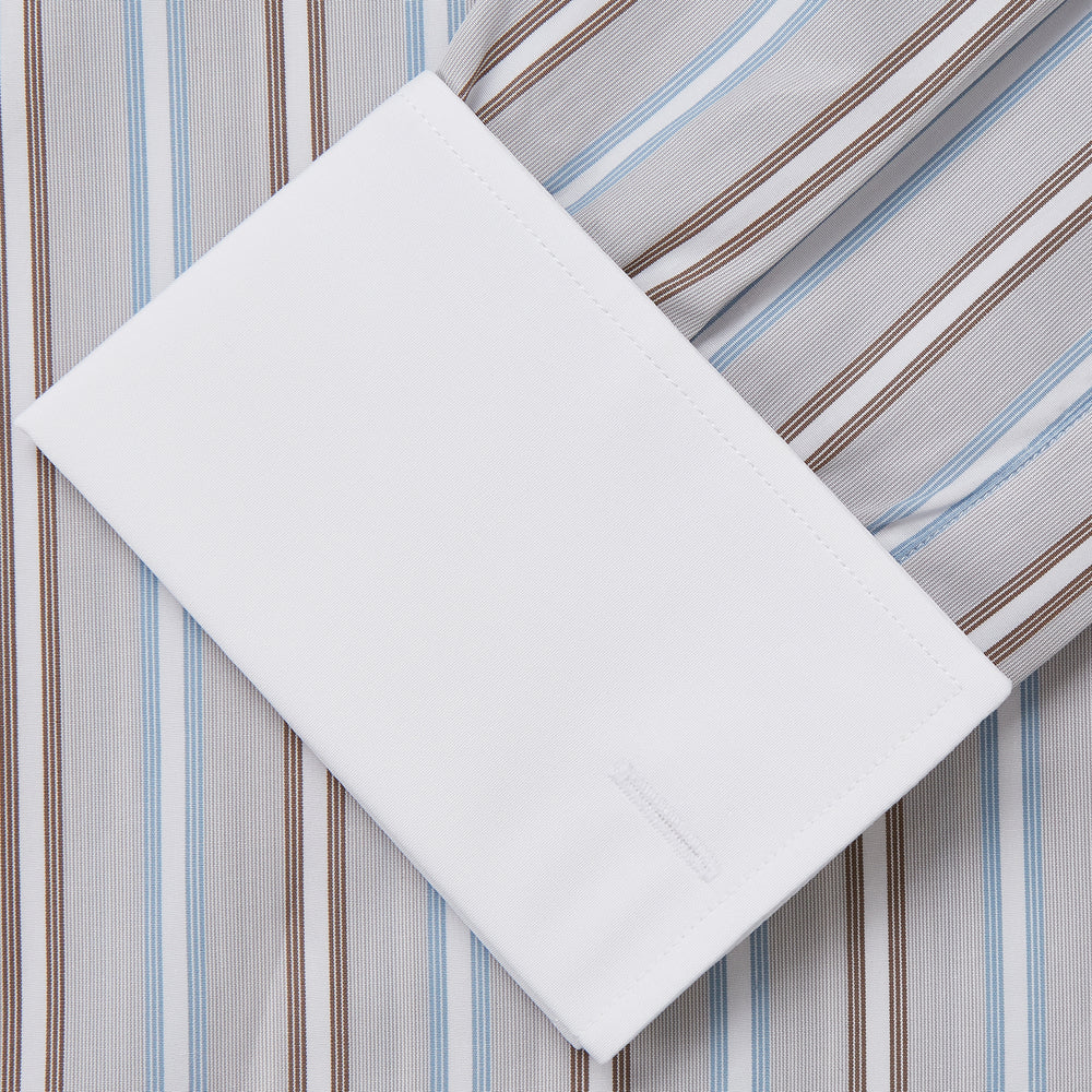 Turnbull & Asser's Beige Multi Stripe Cotton Regular Fit Penrose Shirt features blue, beige, and white vertical stripes with a crisp white collar and cuffs. Displayed on a plain background.