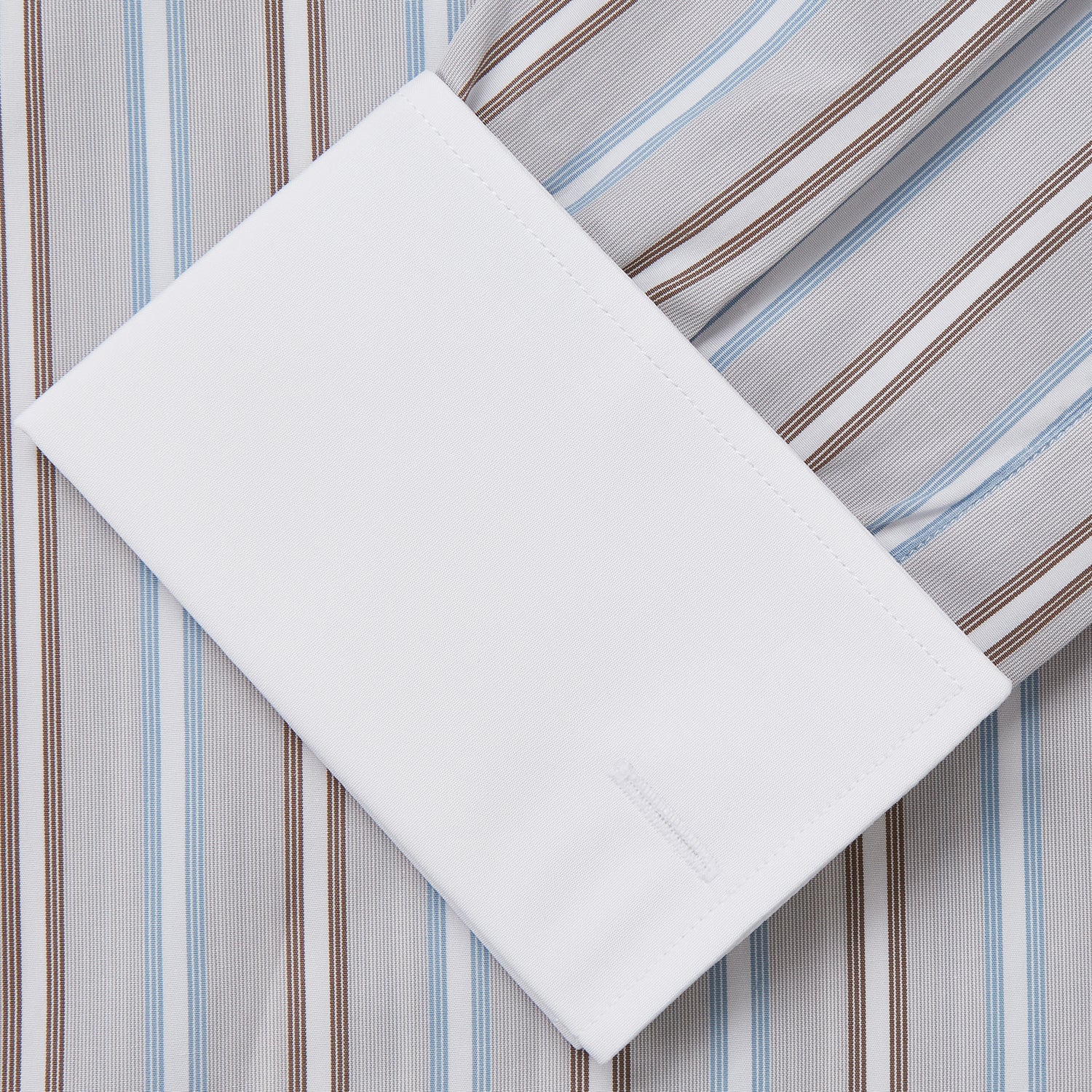 View 3 of product Turnbull & Asser's Beige Multi Stripe Cotton Regular Fit Penrose Shirt features blue, beige, and white vertical stripes with a crisp white collar and cuffs. Displayed on a plain background.