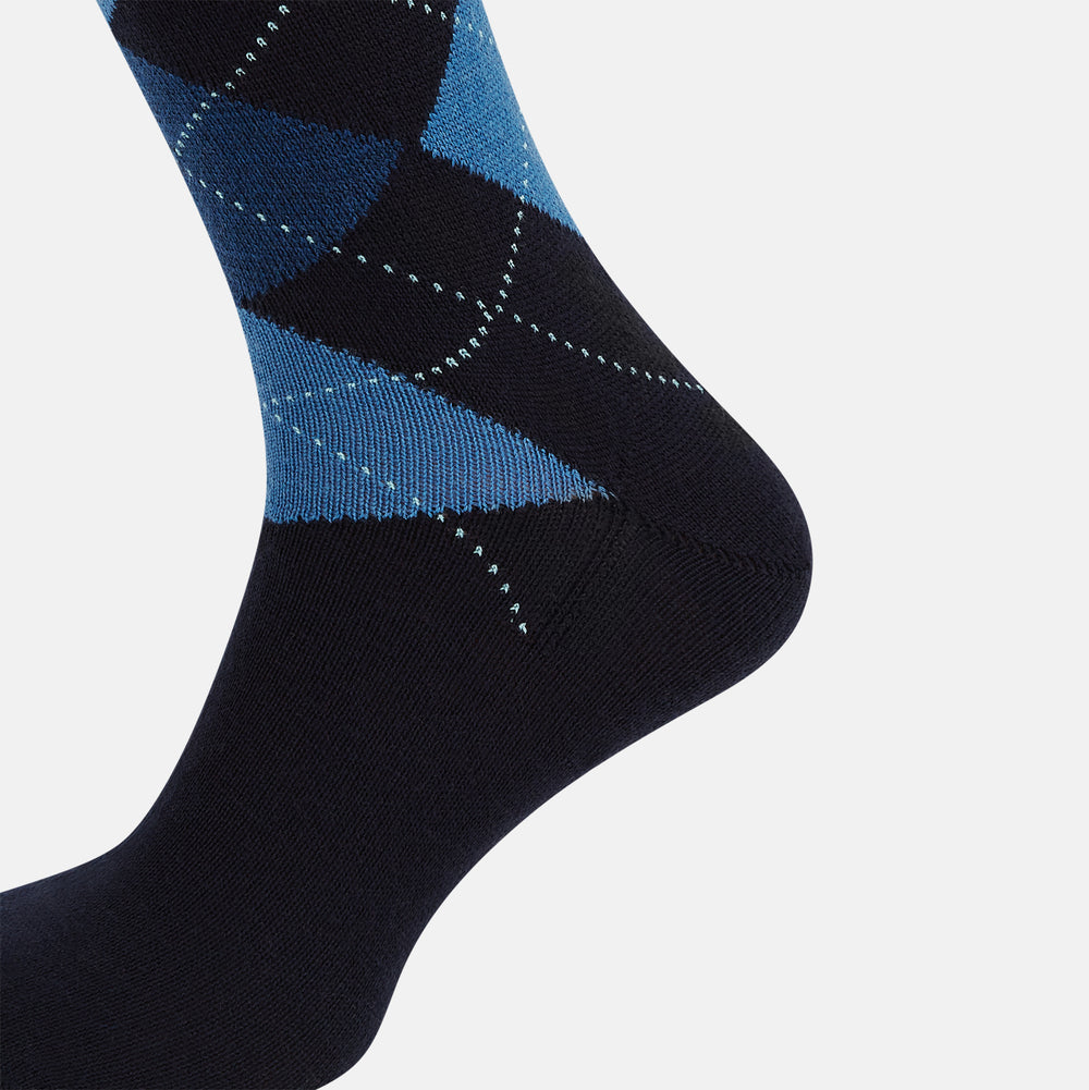 A single Turnbull & Asser Navy/Blue Wool Check Mid-Length Sock, featuring a blue and light blue check pattern, is displayed upright on a plain white background.