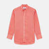 View 1 of product The Turnbull & Asser Pink Linen Weekend Fit Hayne Shirt is a casual, long-sleeve button-down with a subtle texture and white buttons, neatly laid flat on a white background.