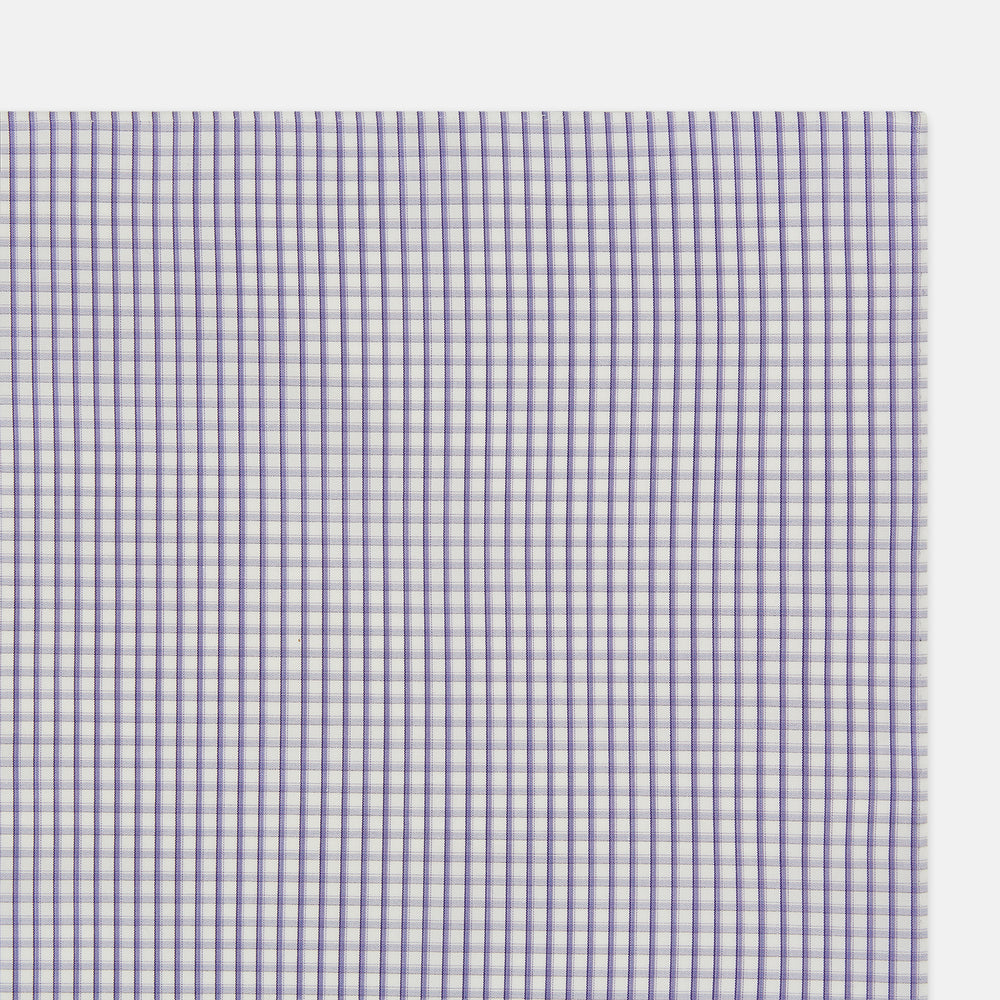 The Turnbull & Asser Purple Micro Shadow Check Hand-Rolled Handkerchief, crafted in England, features a checkered purple and white pattern with fine hand-rolled edges.