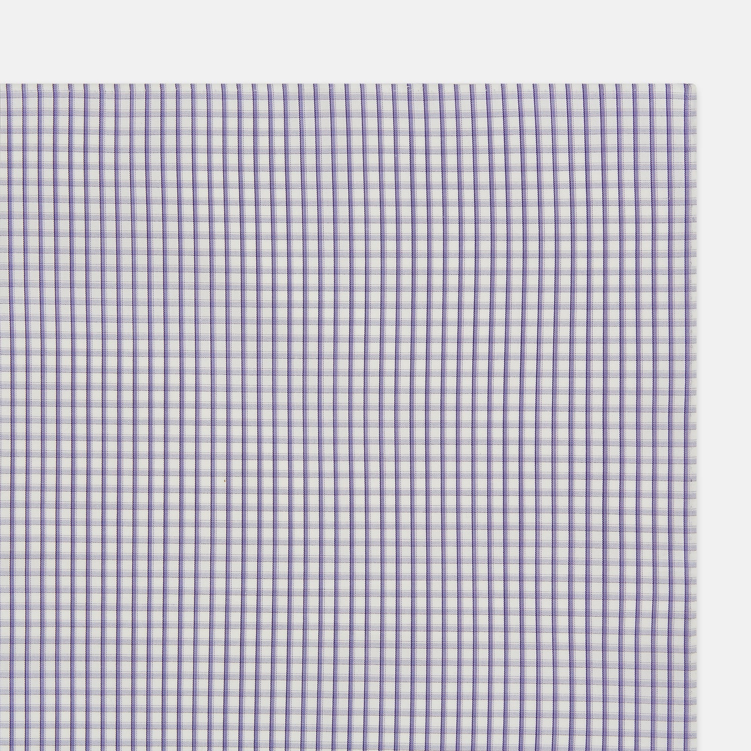 View 2 of product The Turnbull & Asser Purple Micro Shadow Check Hand-Rolled Handkerchief, crafted in England, features a checkered purple and white pattern with fine hand-rolled edges.
