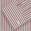 View 5 of product The Turnbull & Asser Burgundy Stripe Weekend Fit Shirt features a Derby collar, 1-button cuffs, and vertical burgundy and white stripes, shown laid flat on a plain light background.