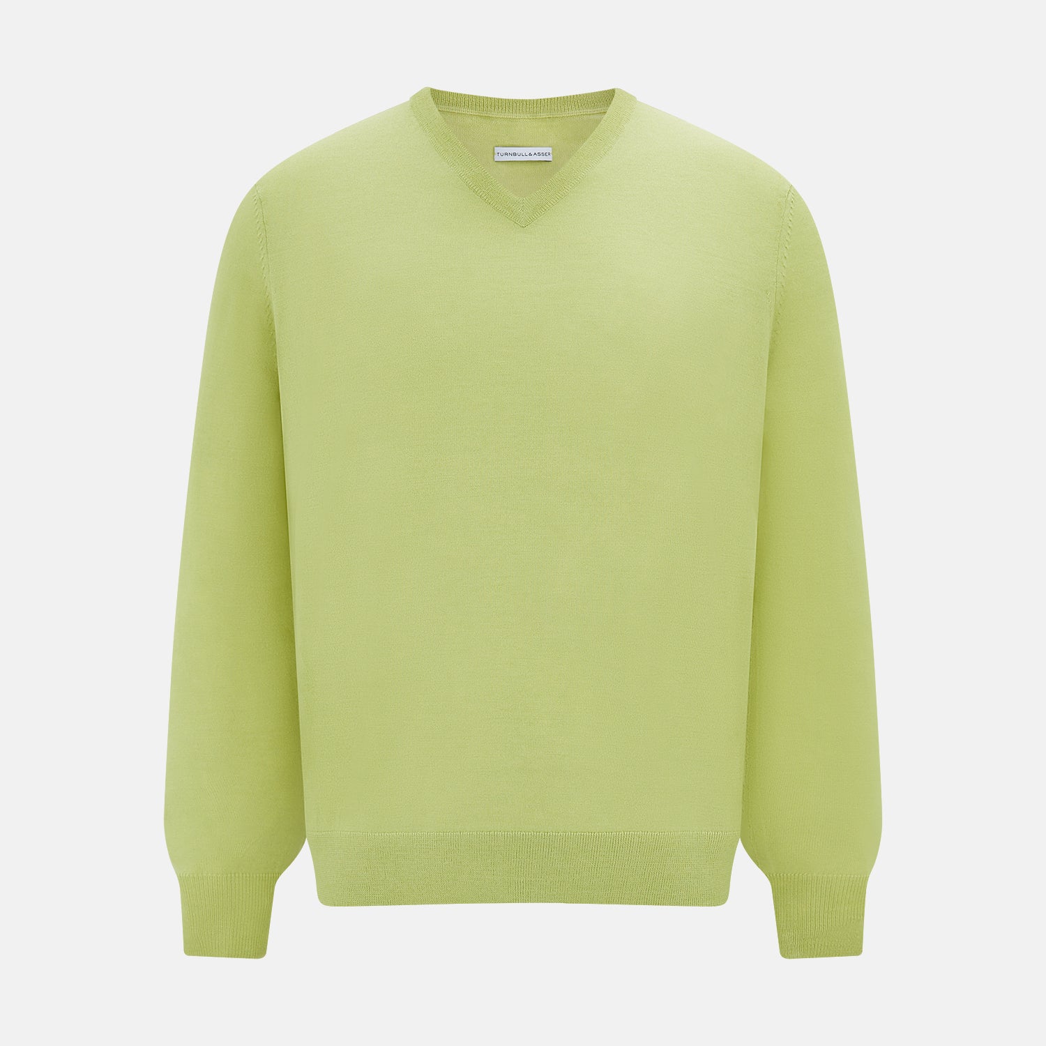 View 1 of product The Turnbull & Asser Melon Green Merino V-Neck Jumper is shown on a white background, featuring long sleeves, ribbed cuffs, and a ribbed hem.
