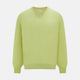 The Turnbull & Asser Melon Green Merino V-Neck Jumper is shown on a white background, featuring long sleeves, ribbed cuffs, and a ribbed hem.