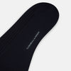View 3 of product A single navy mid-length sock by Turnbull & Asser, crafted from organic cotton with a ribbed texture, stands upright on a white background.