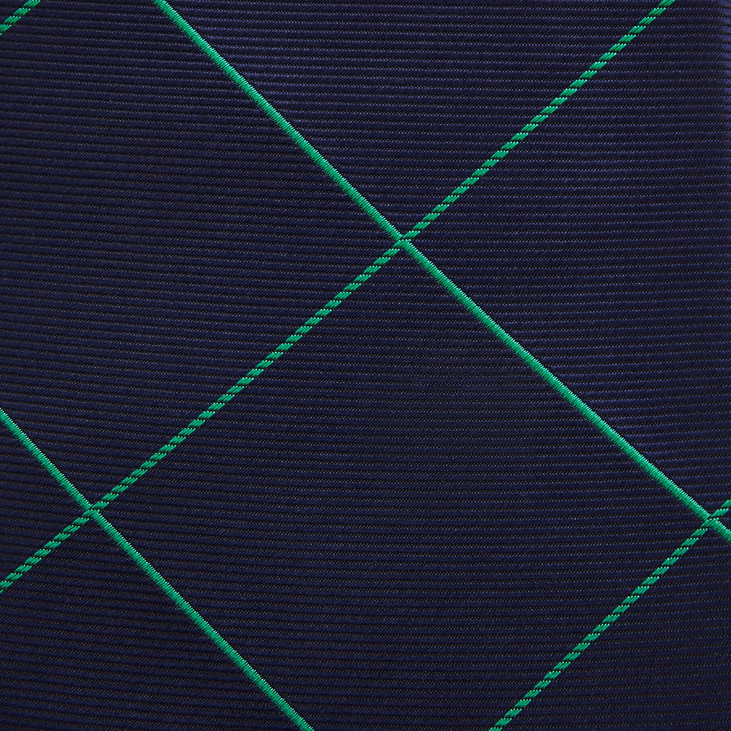 View 3 of product The Turnbull & Asser Green and Navy Window Pane Silk Tie features a subtle ribbed texture with a diagonal green grid pattern, inspired by archival designs—a stylish choice for modern office attire.