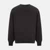 View 3 of product The Turnbull & Asser Charcoal Grey Fine Merino Round Neck Jumper for men features long sleeves, ribbed cuffs, hem, and collar. Displayed on a white background, this classic knitwear piece has a plain design with no visible logos or patterns.
