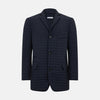 View 1 of product The Fulham Navy Single-Breasted Quilted Blazer by Turnbull & Asser features a notched lapel, three black buttons, a chest pocket, and two front flap pockets. Shown on a plain white background—ideal for the modern gentleman.
