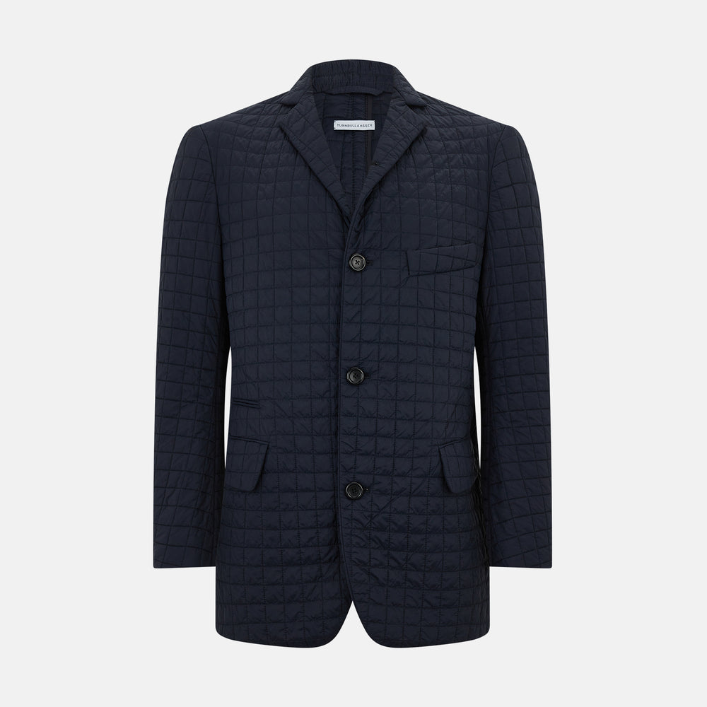 The Fulham Navy Single-Breasted Quilted Blazer by Turnbull & Asser features a notched lapel, three black buttons, a chest pocket, and two front flap pockets. Shown on a plain white background—ideal for the modern gentleman.