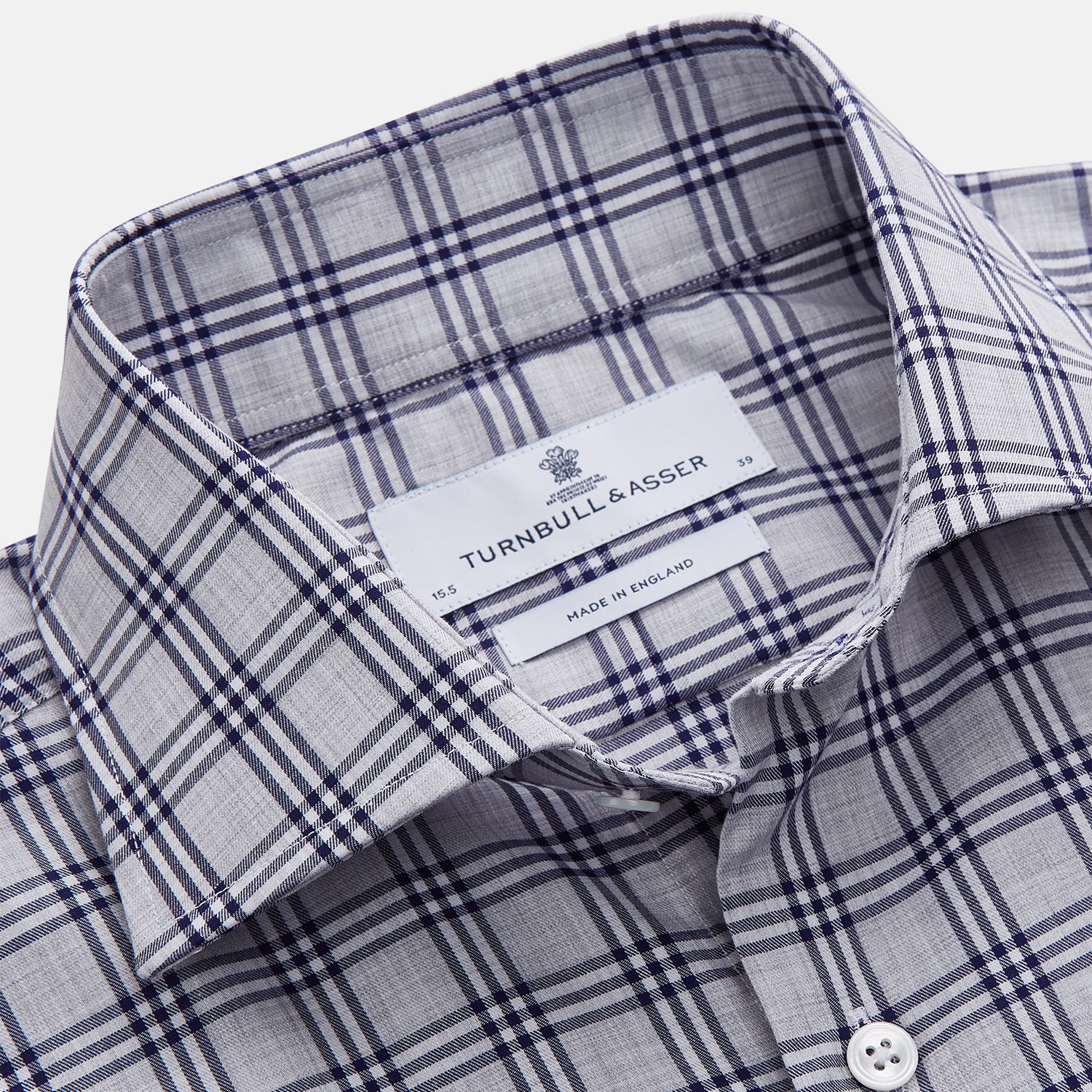 View 3 of product The Turnbull & Asser Grey Multi Check Cotton Tailored Fit Shelton Shirt is neatly laid flat on a white background.