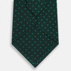 View 3 of product The Turnbull & Asser Dark Green Micro Dot Silk Tie features a refined pattern of light blue micro dots, making it the perfect accessory for any occasion.
