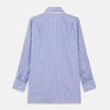 View 3 of product The Turnbull & Asser Pale Blue Candy Stripe Cotton Marlene Shirt is an oversized women's collared shirt with long sleeves, buttoned cuffs, and vertical blue and white stripes, shown laid flat on a white background.