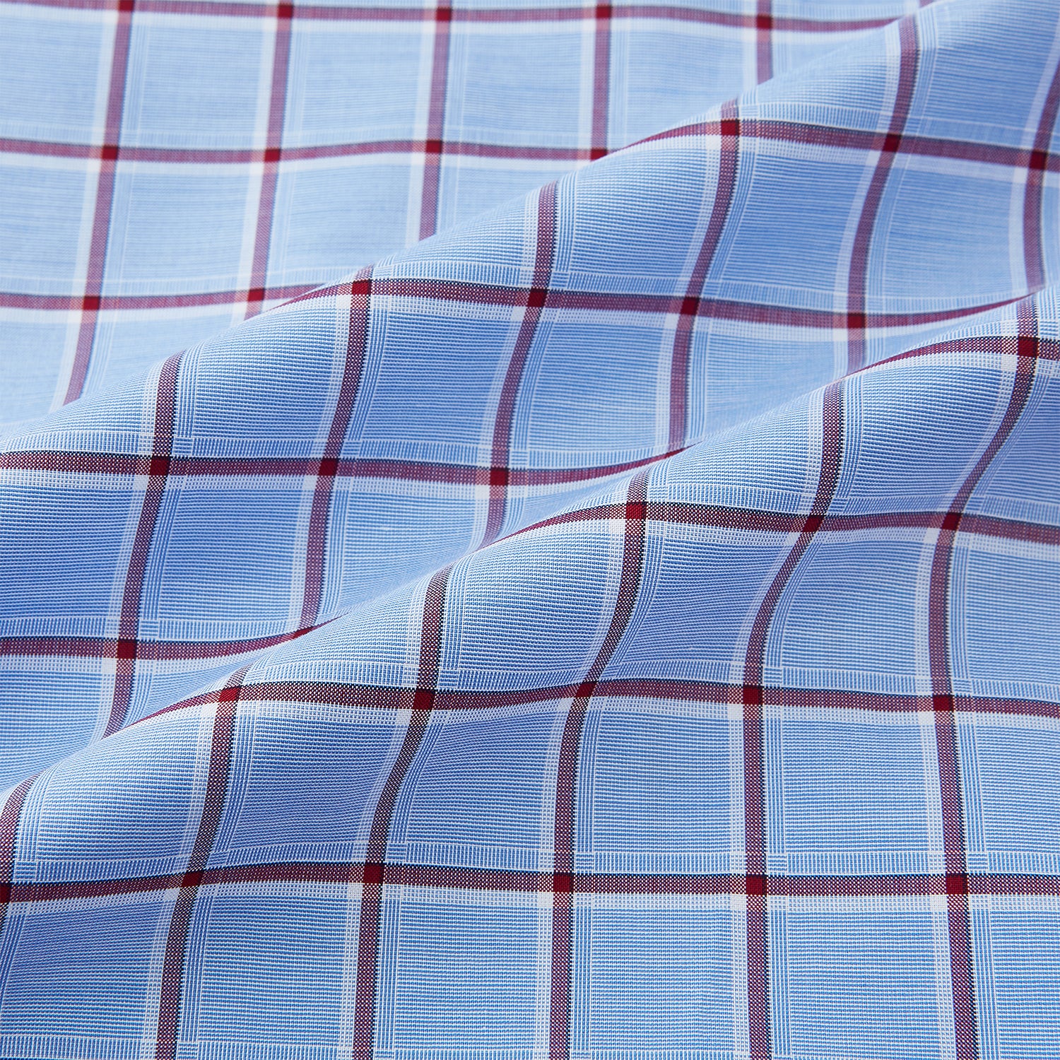 View 6 of product The Turnbull & Asser Blue and Burgundy Windowpane Mayfair Shirt features long sleeves, a light blue base with burgundy windowpane checks, a classic collar, and white buttons.