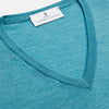 View 2 of product The Turquoise Kennedy Merino V-Neck Jumper by Turnbull & Asser features ribbed cuffs and hem, crafted from premium merino knitwear, and is shown flat on a white background.