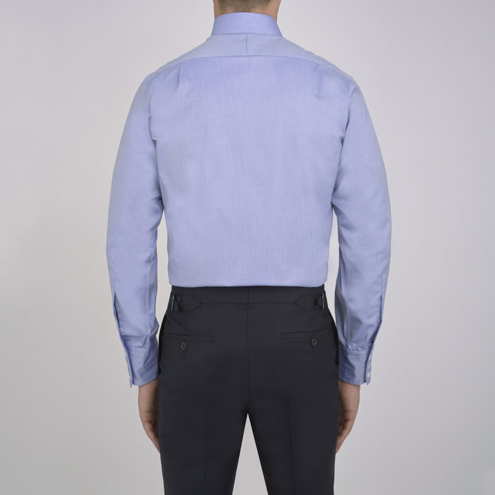 The Turnbull & Asser Blue Royal Oxford Cotton Shirt features a button-down collar, 3-button cuffs, and a visible brand label, shown neatly folded on a white background—ideal for pairing with a navy suit.