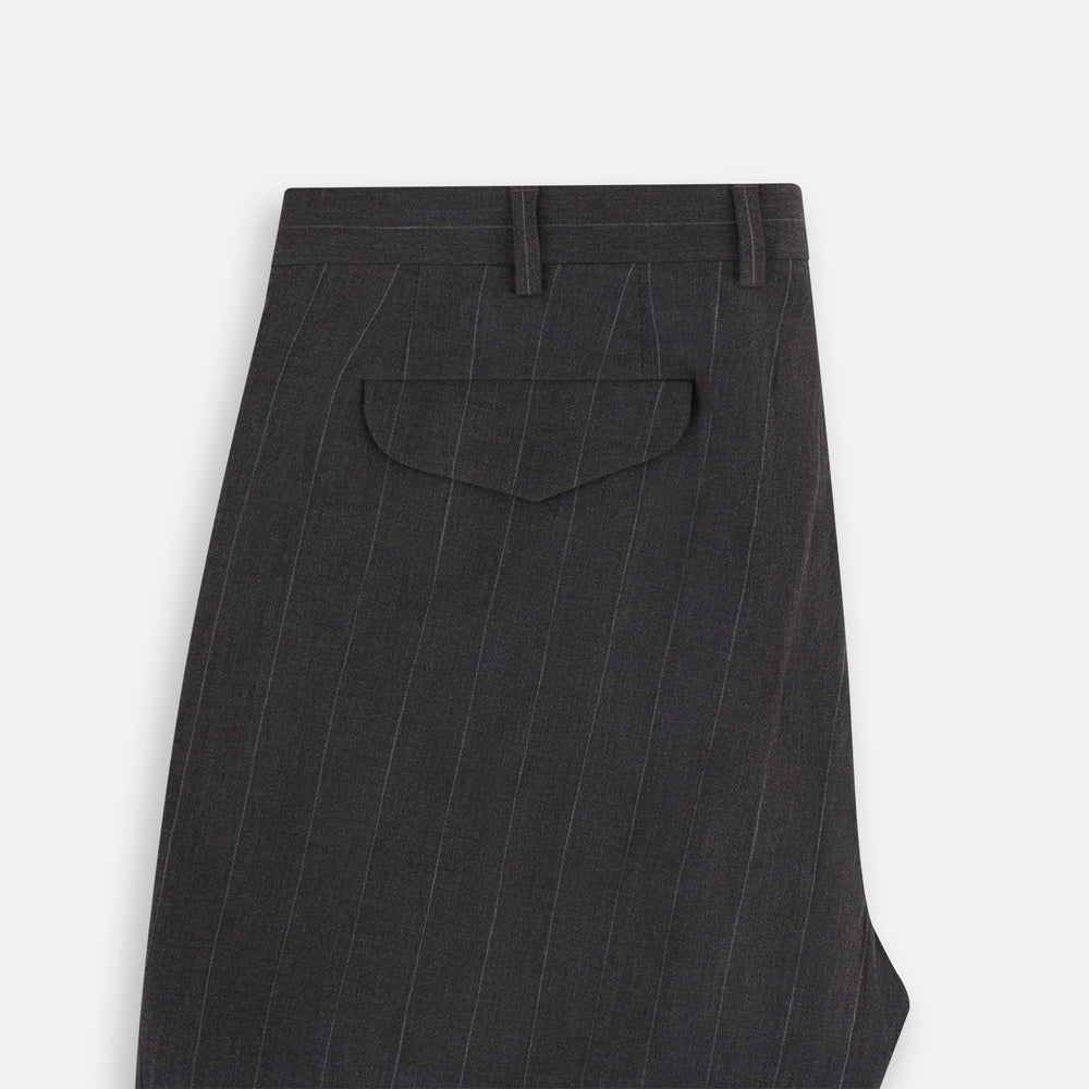 Turnbull & Asser’s Dark Chocolate Striped Edmund trousers feature straight-cut legs, a relaxed fit, button closure, and belt loops. These cotton trousers display subtle vertical stripes against a plain white background.