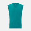 View 1 of product The Turnbull & Asser Turquoise Cashmere V-Neck Vest features ribbed detailing at the neck, armholes, and hem. Shown on a white background, its soft cashmere fabric brings refined charm to any distinguished look.