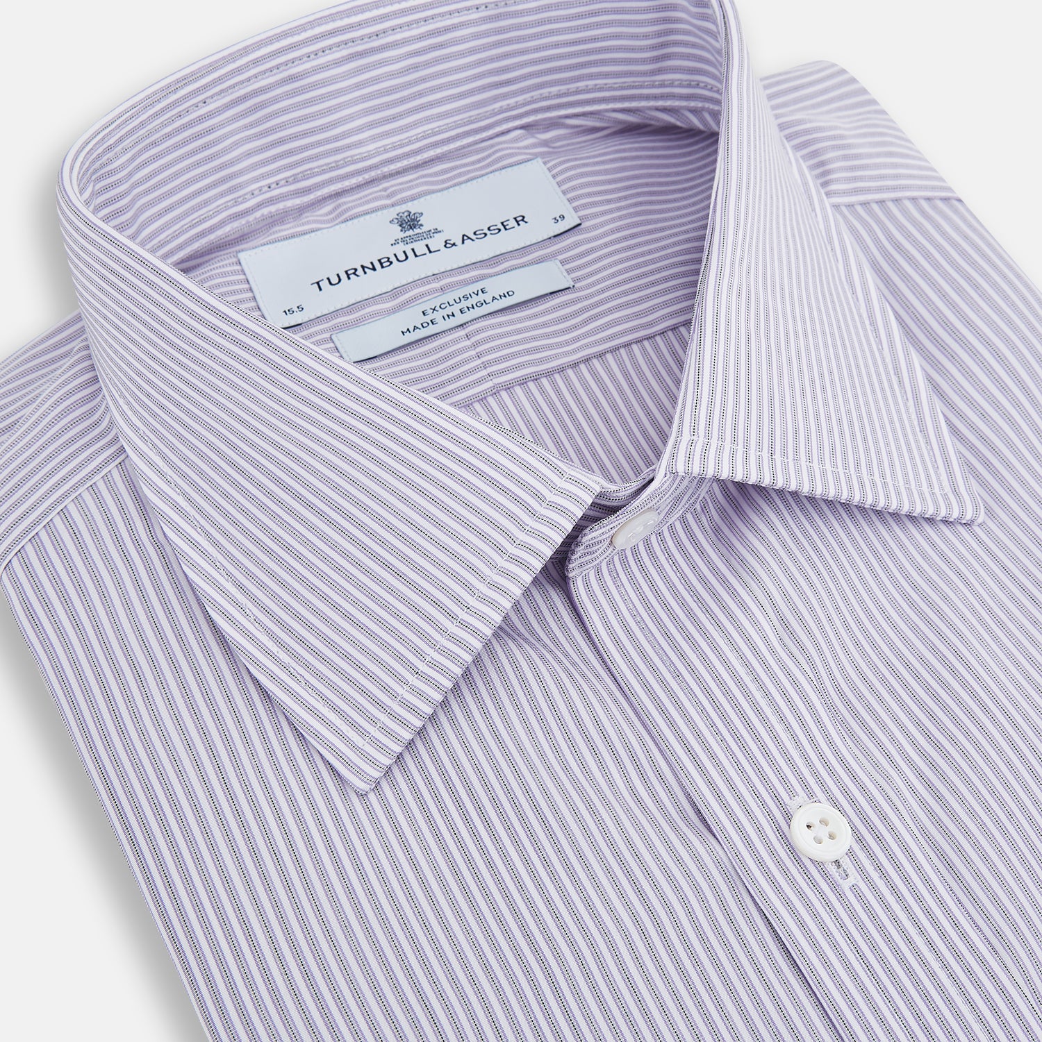 View 2 of product The Lilac Halo Stripe Mayfair Shirt by Turnbull & Asser features a relaxed Mayfair fit, white buttons, a pointed collar, and a subtle lilac stripe pattern for timeless sophistication.