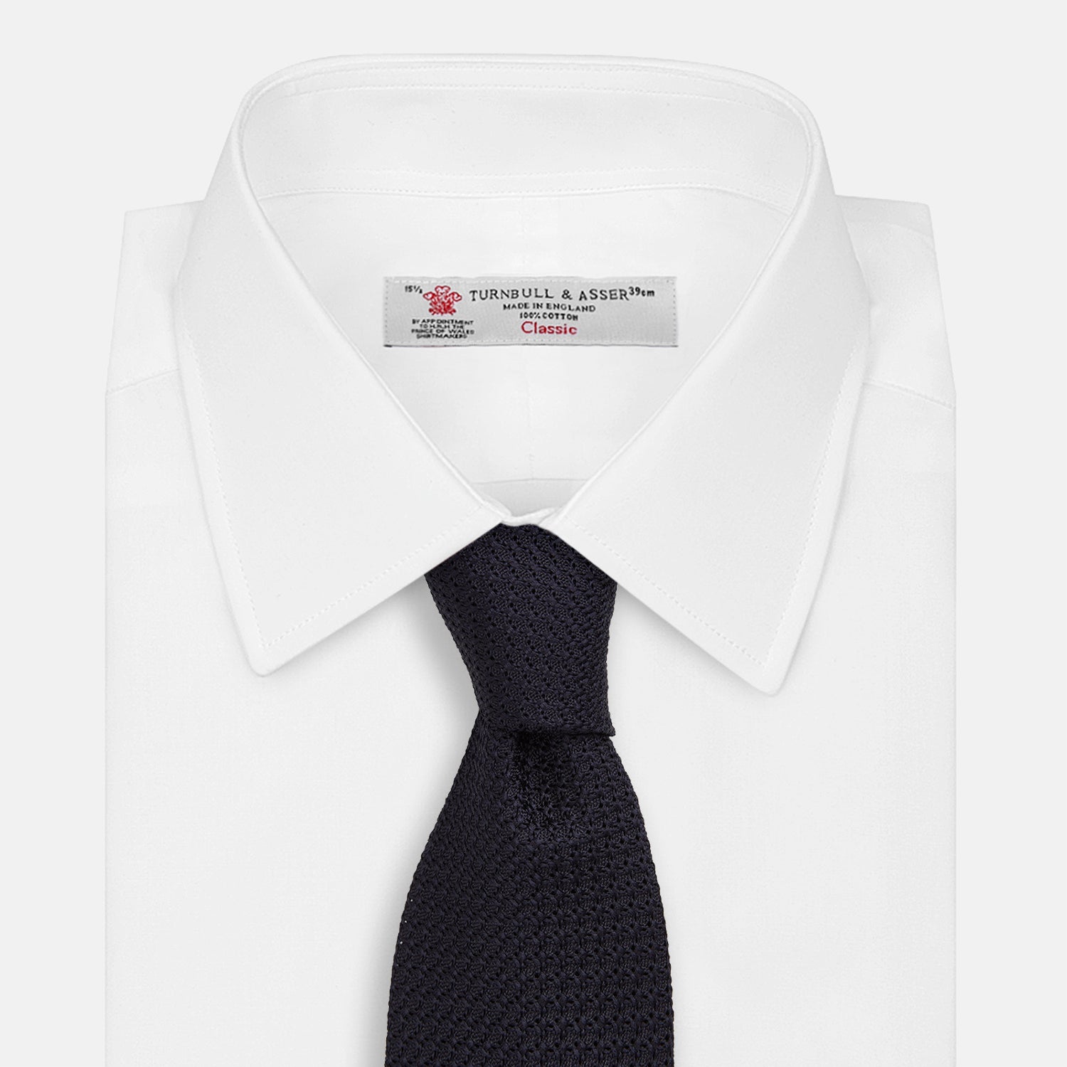 View 2 of product The Turnbull & Asser Midnight Blue Knitted Tie, elegantly textured and displayed on a white background, is a versatile addition to any gentleman's wardrobe.