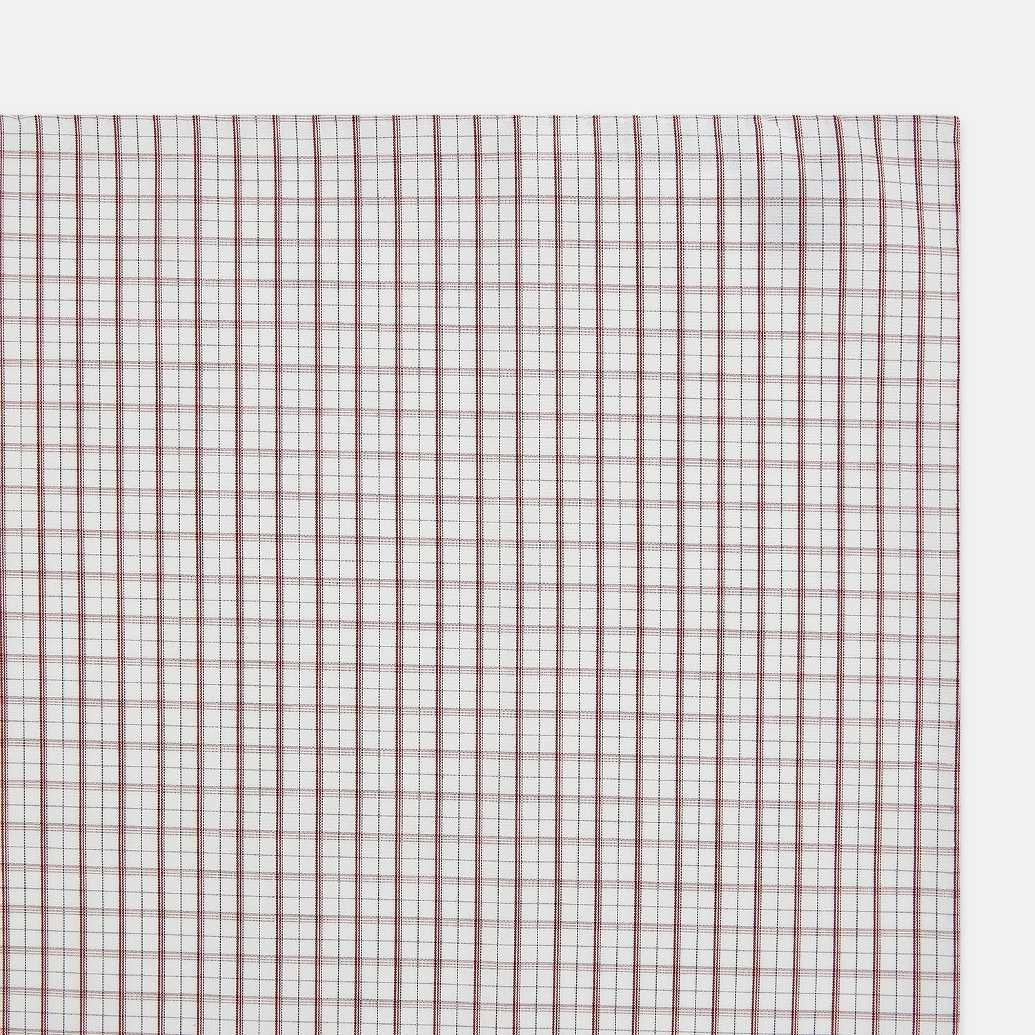 View 2 of product The Turnbull & Asser Red Tattersall Check Hand-Rolled Handkerchief features thin red and blue grid lines on white, laid flat in a rectangular shape and expertly crafted in England.