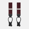 View 1 of product Turnbull & Asser Burgundy Small Spot Adjustable Silk Braces, featuring small white dots, black leather ends, and silver clasps, are displayed vertically on a plain white background for refined sartorial style.