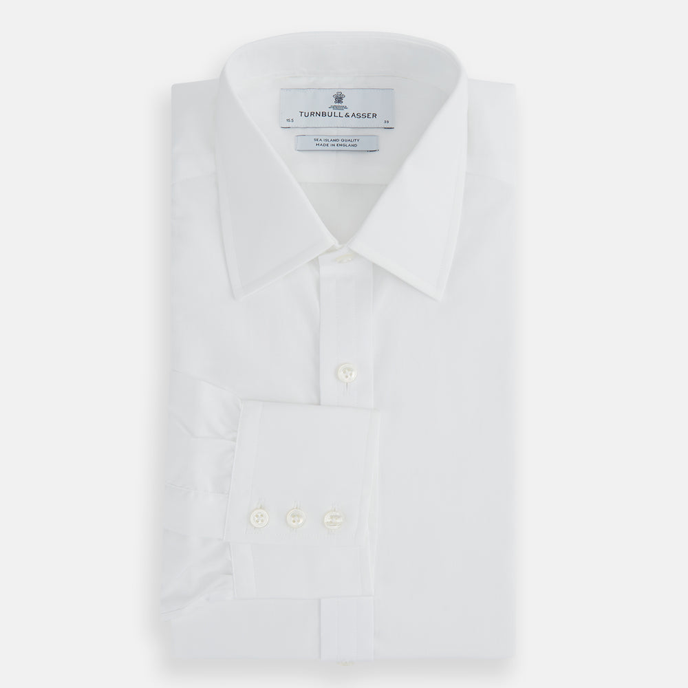 The Turnbull & Asser White Sea Island Quality Cotton Shirt features a T&A collar and 3-button cuffs, crafted from premium cotton and showcased against a plain white background.