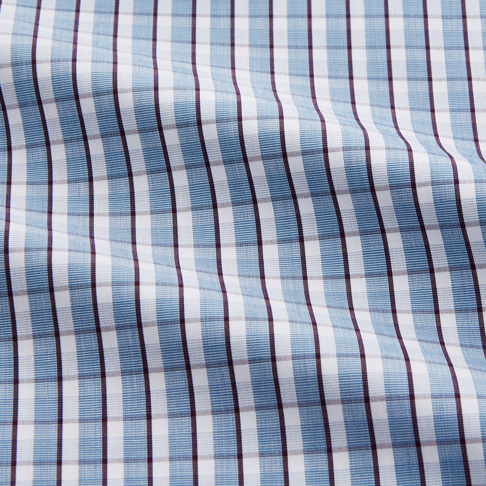 The Turnbull & Asser Blue and White Check Cotton Regular Fit Mayfair Shirt features long sleeves, a pointed collar, and buttoned cuffs, shown here on a white background.
