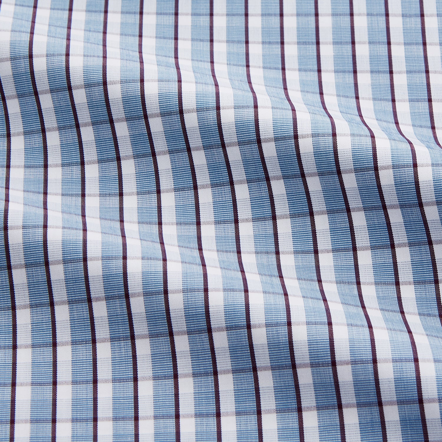 View 5 of product The Turnbull & Asser Blue and White Check Cotton Regular Fit Mayfair Shirt features long sleeves, a pointed collar, and buttoned cuffs, shown here on a white background.
