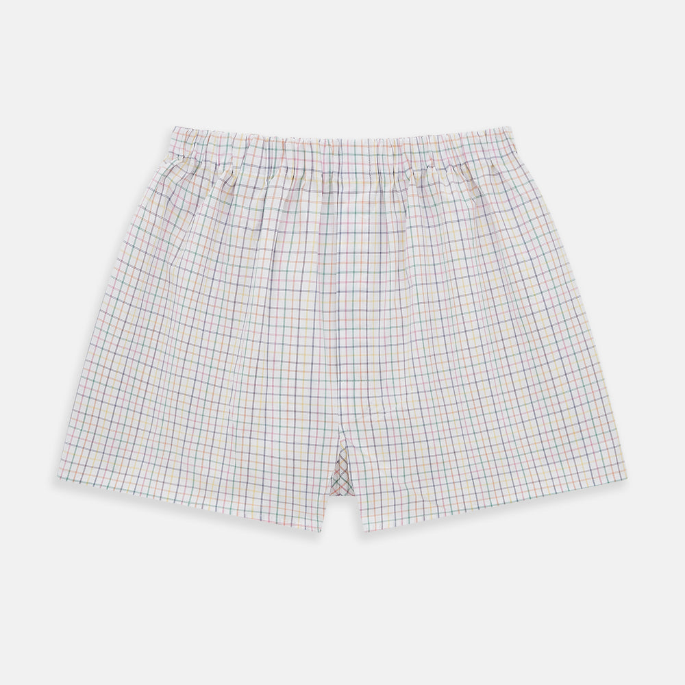 The Rainbow Check Godfrey Boxer Shorts by Turnbull & Asser are crafted from white Italian cotton with an elastic waistband and feature a colorful checked pattern in thin blue, red, and green lines. They are shown flat against a white background.
