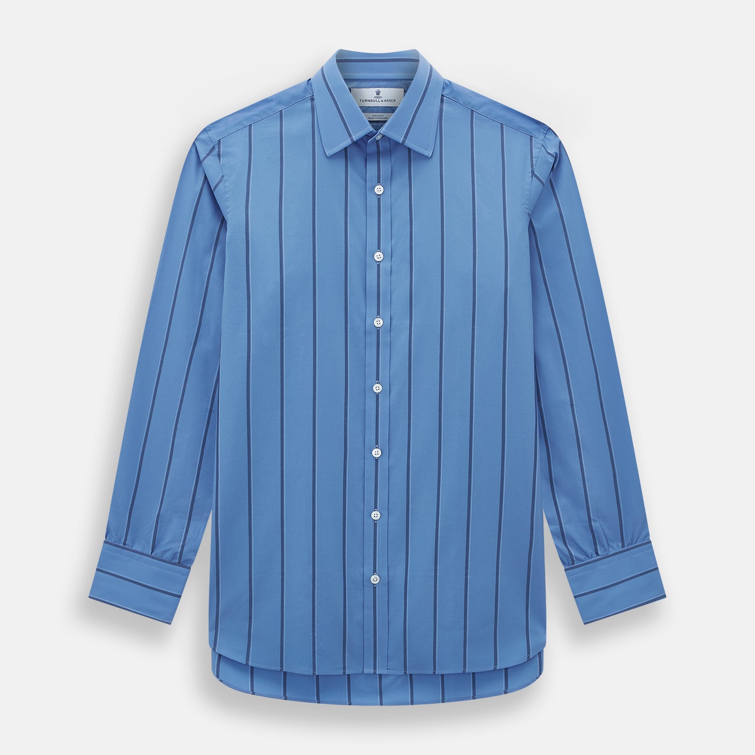 View 1 of product The Turnbull & Asser Colony Blue Track Stripe Mayfair Shirt is crafted from Italian cotton with long sleeves, dark blue track stripes, a classic collar, and buttoned cuffs, shown against a white background.