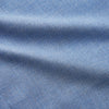 View 3 of product The Turnbull & Asser Blue Cotton Weekend Fit Blake Shirt features a light blue color, long sleeves, stand collar, white buttons, and a curved hem—ideal for casual weekends. Laid flat on a white background.