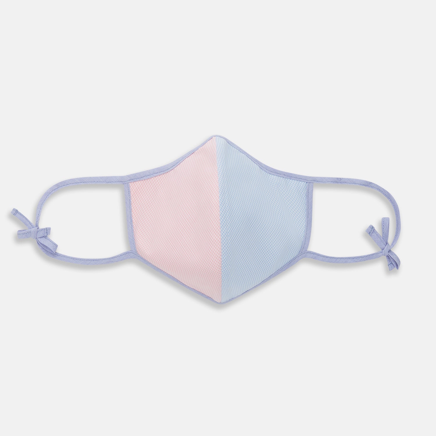 View 1 of product The Turnbull & Asser Pink & Blue Check Commuter Mask features lavender adjustable ear loops tied in bows and comes with 3 Viroformula™ filters. Shown on a plain white background.