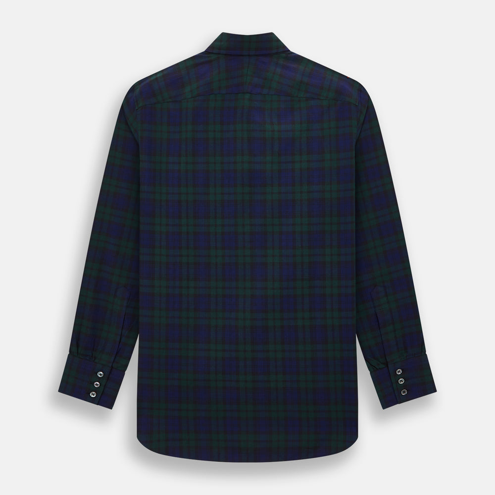 The Turnbull & Asser Black Watch Tartan Windsor Shirt is a long-sleeve, button-up shirt with a dark green and navy tartan pattern, white buttons, collar, and curved hem—showcasing British craftsmanship on a plain white background.