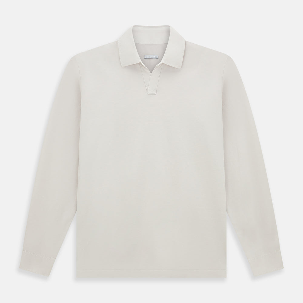 A pale pink luxury cotton rugby polo shirt by Turnbull & Asser, featuring long sleeves and a collar with no buttons, displayed flat on a white background.
