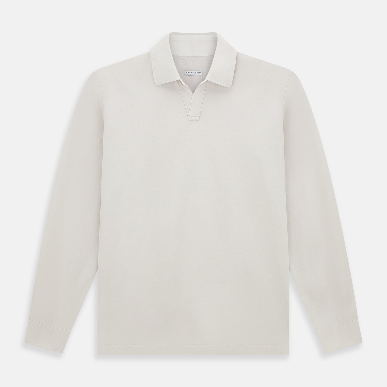 View 1 of product A pale pink luxury cotton rugby polo shirt by Turnbull & Asser, featuring long sleeves and a collar with no buttons, displayed flat on a white background.