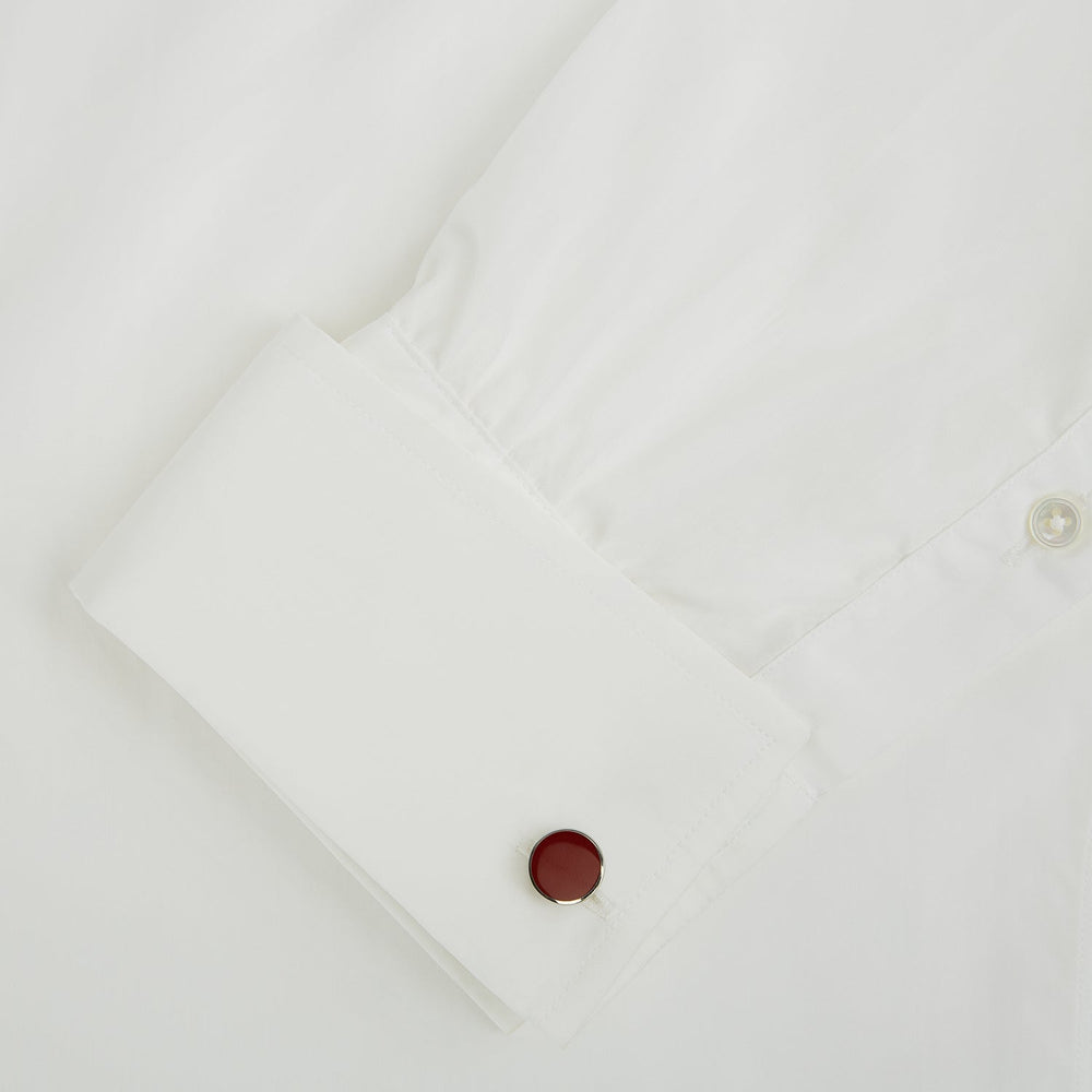 Turnbull & Asser's Red Circle Cufflinks feature round sterling silver with bold red enamel centers, offering a refined accessory for gentlemen, shown on a white background.