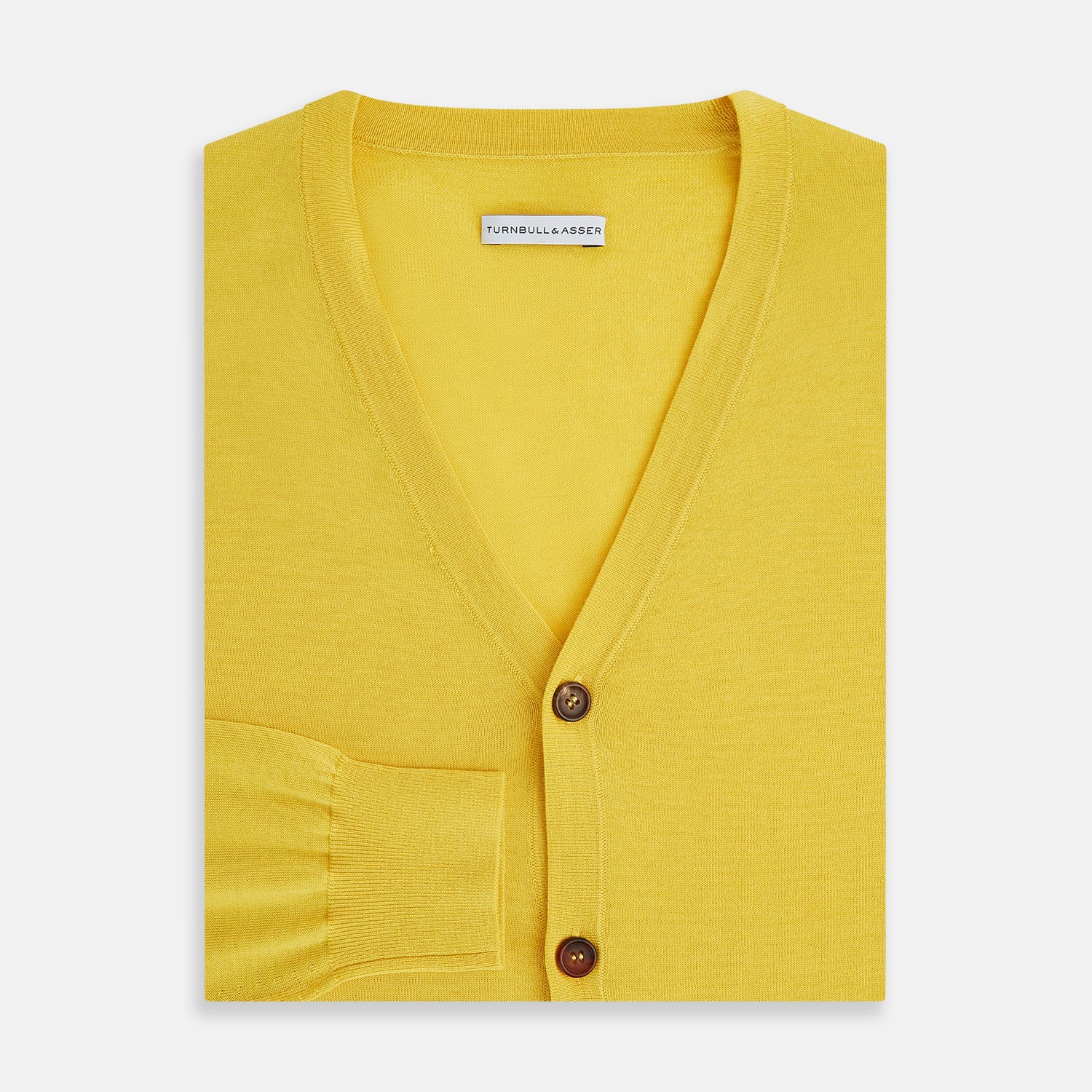 View 4 of product The Turnbull & Asser Canary Yellow Fine Merino V-Neck Cardigan features long sleeves, a button front with brown buttons, and ribbed cuffs and hem, displayed on a plain white background.