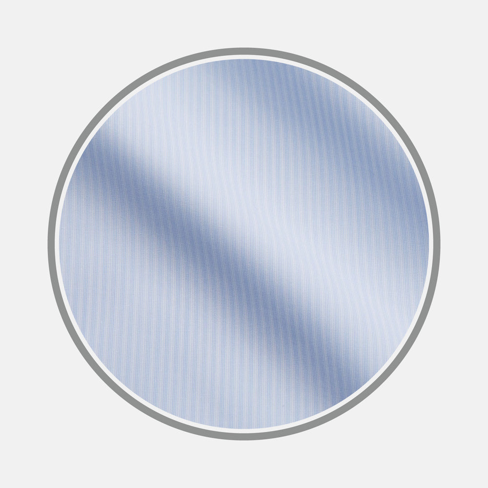 A circular swatch of Turnbull & Asser's Pale Blue Stripe Cotton Fabric, featuring subtle white vertical pinstripes on light blue, is shown against a white background with a gray-bordered circle.