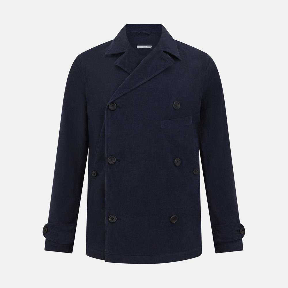 The Turnbull & Asser Light Navy Kingston Corduroy Caban Jacket features a double-breasted stretch cotton corduroy design with black buttons, notched collar, and long buttoned cuffs, displayed on a plain white background.