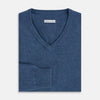 View 4 of product Turnbull & Asser’s Pacific Blue Cashmere V-Neck Jumper features ribbed cuffs, hem, and neckline, shown on a white background.