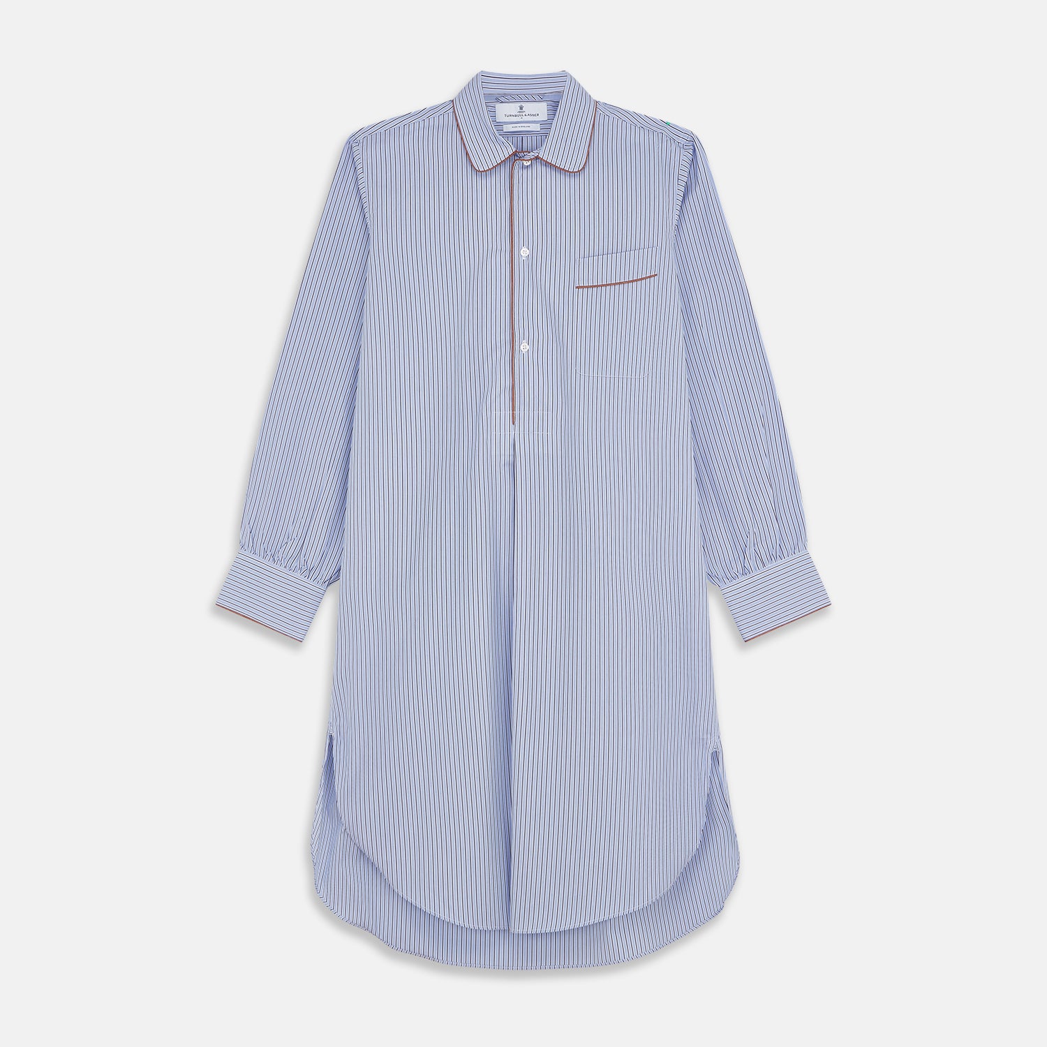 View 1 of product The Blue and Navy Halo Stripe Cotton Sussex Nightshirt by Turnbull & Asser features long sleeves, a collar, button-down front, chest pocket, curved hem, and brown piping for a classic luxury sleepwear style.