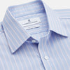 View 2 of product The Turnbull & Asser Blue Multi Stripe Cotton Regular Fit Whitby Shirt features white vertical stripes, long sleeves, button-down front, pointed collar, and buttoned cuffs, shown laid flat on a white background.